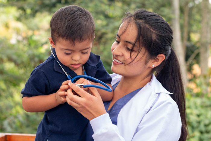 Doctor holding child